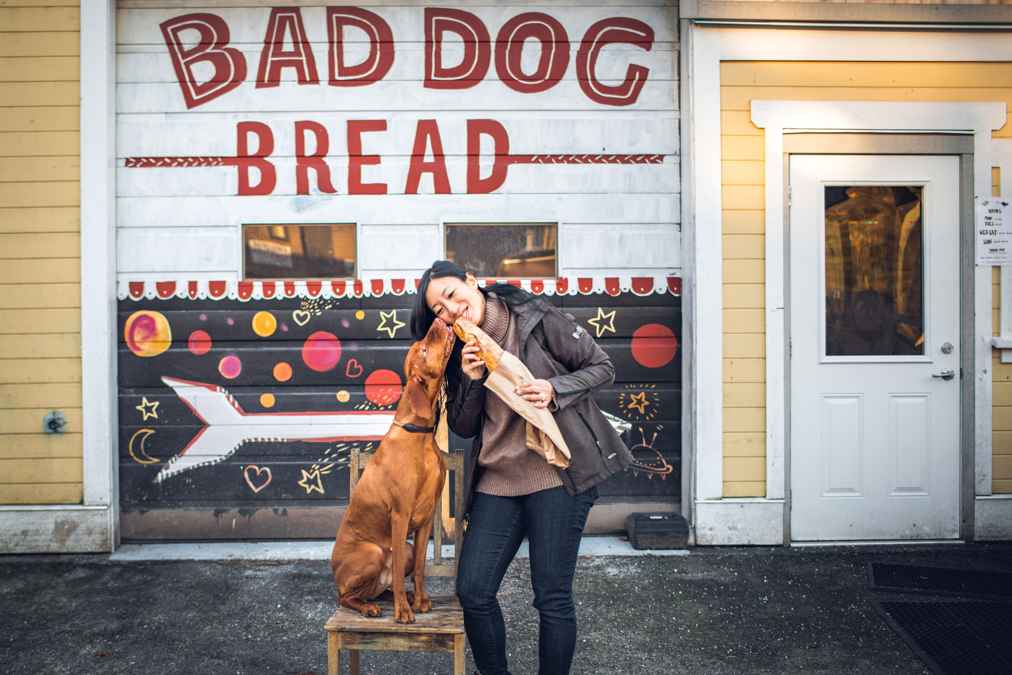 Woman and Dog eating baguette