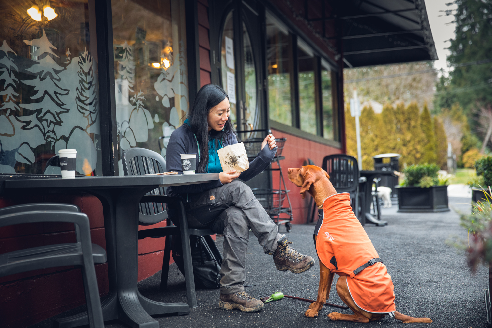 Woman and dog at cafe
